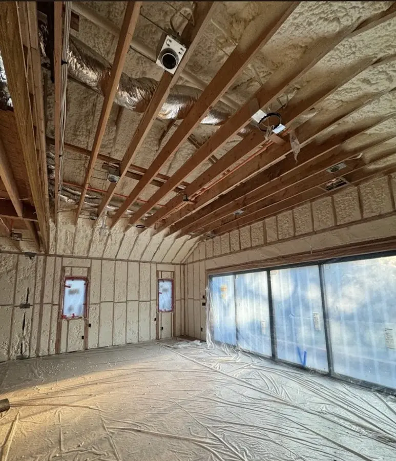 Interior walls and ceiling insulated with spray foam during new construction in Arlington